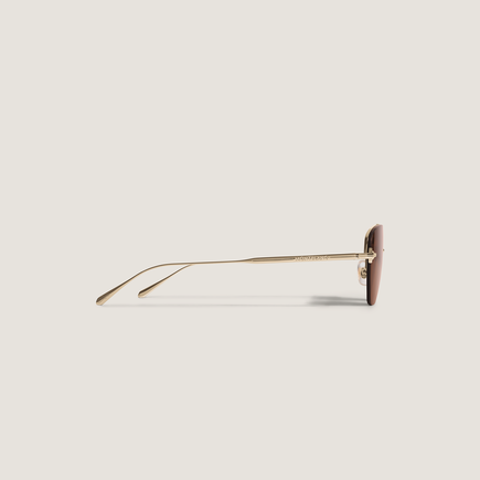 Gafas de sol ovaladas con montura metálica dorada